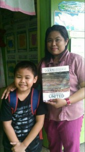 This kid gave a copy of the Pasugo magazine to his teacher in the Philippines.