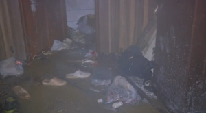 Slippers and various belongings are scattered in the flooded floor inside a massage parlor where the fire started at Capitol Hotel in Iraq's Kurdistan. (Photo grabbed from Reuters video/Courtesy Reuters)