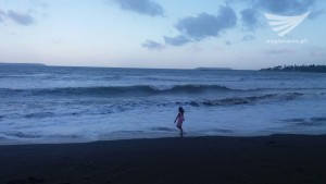 Girl watching the waves in Baybay, Borongan City. (Photo by Michael Agustin)
