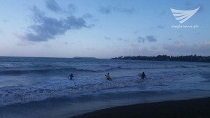 Three girls ready to surf in Baybay boulevard, Borongan City (Photo by Michael Agustin) Eagle News Service)