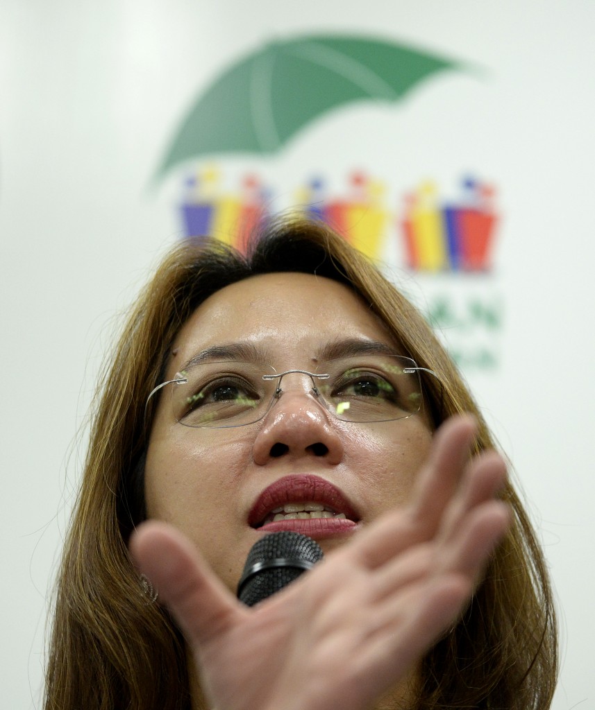 Department of Health (DOH) secretary Janette Garin gestures during a press conference on the Zika Virus at the DOH headquarters in Manila on March 14, 2016. The DOH announced that it will strengthen its monitoring against the Zika Virus and called all pregnant women to be more careful against mosquito bites during the day. / AFP / NOEL CELIS