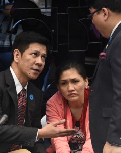 In this photo taken on March 17, 2016 Maia Deguito (C), manager of the Rizal Commercial Banking Corp (RCBC) branch in Manila's financial district, conferes with her lawyers (L/R) at a senate hearing in Manila. When mystery hackers launched a stunning raid on Bangladesh's foreign reserves, a plot worthy of a John le Carre spy novel began in the Philippines exposing the Southeast Asian nation as a dirty money haven. / AFP / TED ALJIBE