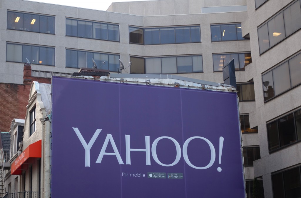 (FILES) This file photo taken on August 5, 2015 shows a billboard for the technology company Yahoo in Washington, DC. An activist hedge fund on March 24, 2016 launched a bid to replace the entire Yahoo board of directors, saying the struggling Internet firm's management team has "failed to deliver results." In an open letter to Yahoo shareholders, Starboard Value LP said it would nominate nine "highly qualified" directors to the company's board, following a threat made last year to do so if it was unsatisfied with the pace of change. / AFP / KAREN BLEIER