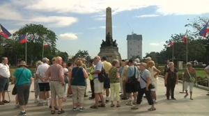 Students, tourists and astronomy enthusiasts in the Philippines gather to watch a partial solar eclipse in Manila. (Photo grabbed from Reuters video)