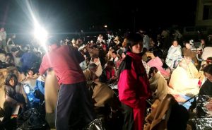 Residents gather for shelter in front of the town hall following an earthquake at Mashiki town in Kumamoto prefectuire on April 14, 2016. The strong 6.4-magnitude earthquake struck at 9:26 pm (1226 GMT) in Kumamoto, central Kyushu at a relatively shallow depth of 10 kilometres (6.2 miles), the Japan Meteorological Agency said. ==JAPAN OUT== / AFP PHOTO / JIJI PRESS / JIJI PRESS