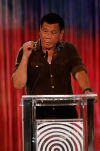 Philippines' presidential candidate, Mayor Rodrigo Duterte, speaks during the presidential debate at the Phinma University of Pangasinan in Dagupan City, on April 24, 2016. More than 50 million people in the mainly Catholic Asian nation are qualified to vote on May 9 with Duterte holding a clear lead over four other candidates, including Aquino's preferred successor. / AFP PHOTO / POOL / MANILA BULLETIN
