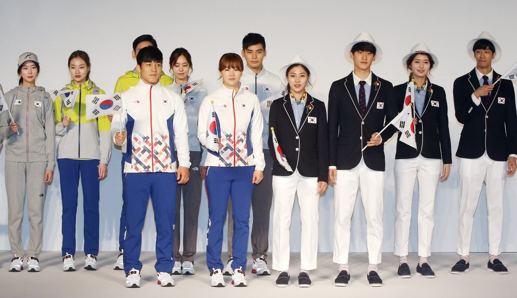 In a picture taken on April 27, 2016, South Korean Olympic athletes and models show the South Korean Olympic team uniforms for the 2016 Rio Olympic Games at the Korean National Training Center in Seoul. South Korean athletes at the Rio Olympics will wear long-sleeved training kits impregnated with mosquito repellant to protect them from the Zika virus, the national Olympic committee said on April 28. / AFP PHOTO / YONHAP / YONHAP / South Korea OUT / REPUBLIC OF KOREA OUT  NO ARCHIVES  RESTRICTED TO SUBSCRIPTION USE