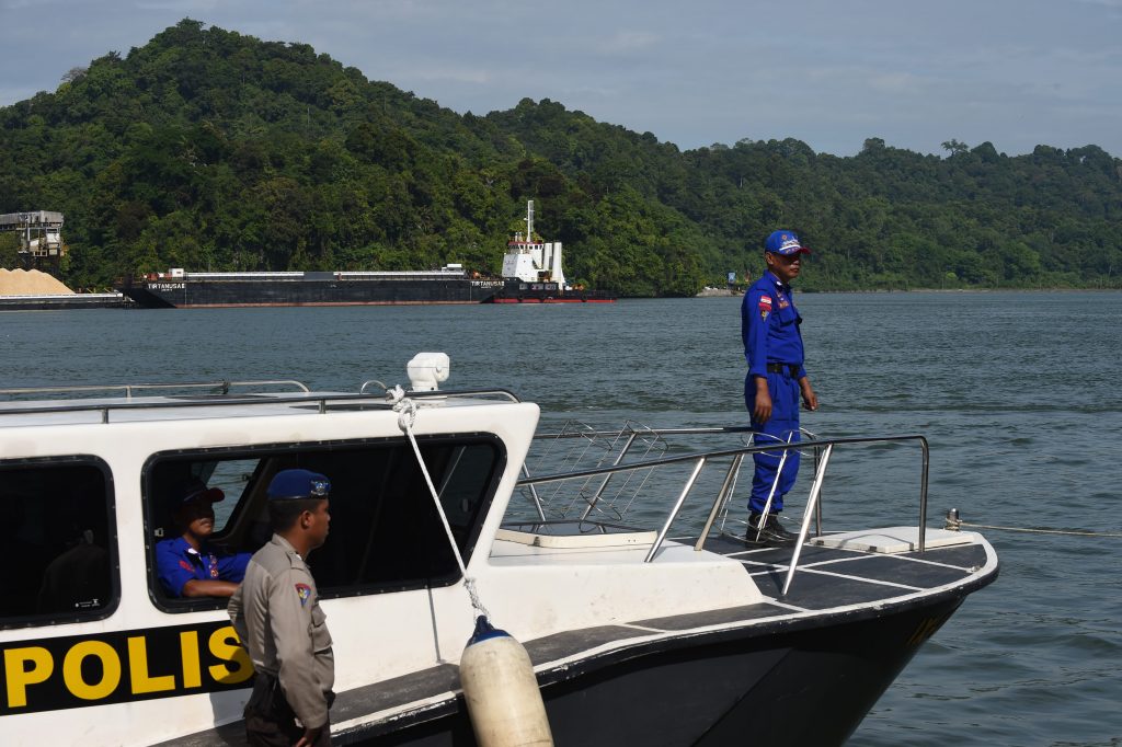 Indonesian maritime police secure the Nusakambangan port in Cilacap across from the Nusakambangan maximum security prison island (background) on April 29, 2015, following the execution of seven foreign drug convicts and an Indonesian man. Indonesia on April 29 defended the execution of seven foreign drug convicts, with the attorney general saying that although the death penalty was not "pleasant" it was vital in waging a war against drugs. AFP PHOTO / ROMEO GACAD / AFP PHOTO / ROMEO GACAD