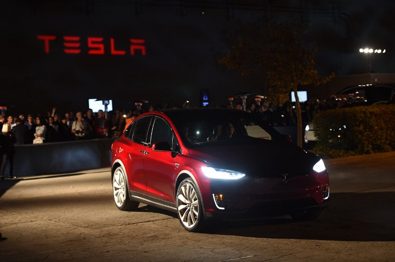 People test drive the Tesla Model X at the launch event in Femont, California on September 29, 2015. AFP PHOTO/SUSANA BATES / AFP PHOTO / SUSANA BATES