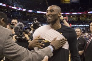 OKLAHOMA CITY, OK - APRIL 11: Kobe Bryant #24 of the Los Angeles Lakers says good bye to Oklahoma City Thunder players and officials after f a NBA game at the Chesapeake Energy Arena on April 22, 2016 in Oklahoma City, Oklahoma.    J Pat Carter/Getty Images/AFP
