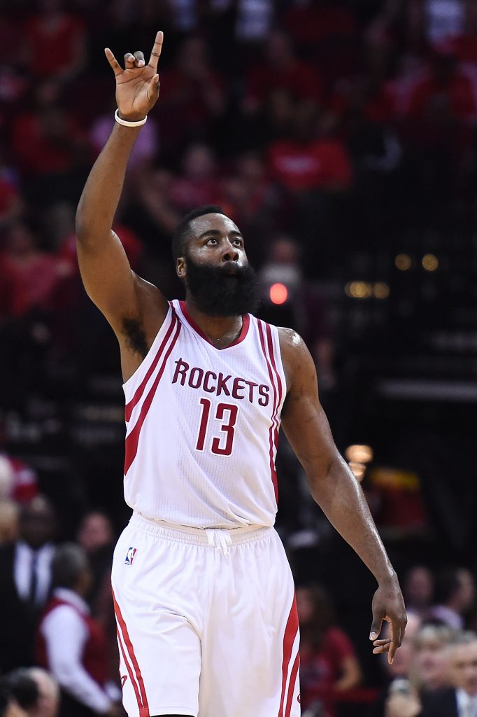 HOUSTON, TEXAS - APRIL 13: James Harden #13 of the Houston Rockets reacts to a three point shot during the second half of a game against the Sacramento Kings at the Toyota Center on April 13, 2016 in Houston, Texas. NOTE TO USER: User expressly acknowledges and agrees that, by downloading and or using this photograph, User is consenting to the terms and conditions of the Getty Images License Agreement. Stacy Revere/Getty Images/AFP