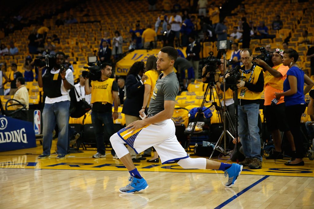 OAKLAND, CA - APRIL 18: Stephen Curry #30 of the Golden State Warriors stretches in the pregame warm up before Game Two of the Western Conference Quarterfinals against the Houston Rockets during the 2016 NBA Playoffs at ORACLE Arena on April 18, 2016 in Oakland, California. NOTE TO USER: User expressly acknowledges and agrees that, by downloading and or using this photograph, user is consenting to the terms and conditions of Getty Images License Agreement.   Lachlan Cunningham/Getty Images/AFP
