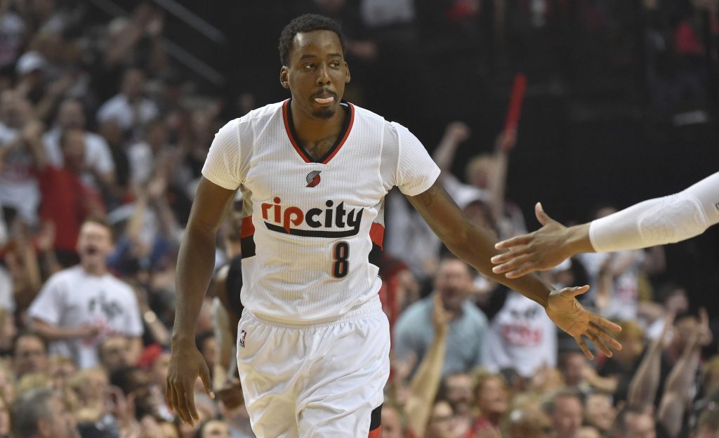 PORTLAND, OR - APRIL 25: Al-Farouq Aminu #8 of the Portland Trail Blazers celebrates with a teammate after hitting a three point shot in the first quarter of Game Four of the Western Conference Quarterfinals against the Los Angeles Clippers during the 2016 NBA Playoffs at the Moda Center on April 25, 2016 in Portland, Oregon. NOTE TO USER: User expressly acknowledges and agrees that by downloading and/or using this photograph, user is consenting to the terms and conditions of the Getty Images License Agreement.   Steve Dykes/Getty Images/AFP