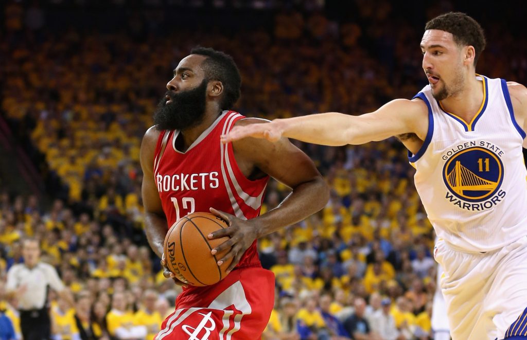 OAKLAND, CA - APRIL 27: James Harden #13 of the Houston Rockets drives on Klay Thompson #11 of the Golden State Warriors in Game Five of the Western Conference Quarterfinals during the 2016 NBA Playoffs at ORACLE Arena on April 27, 2016 in Oakland, California. NOTE TO USER: User expressly acknowledges and agrees that, by downloading and or using this photograph, user is consenting to the terms and conditions of Getty Images License Agreement.   Ezra Shaw/Getty Images/AFP