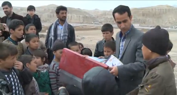 A school teacher delivers books by bicycle to children in remote areas of Afghanistan, giving them a chance to learn to read and gain knowledge.(photo grabbed from Reuters video) 