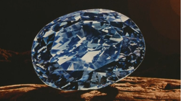 The largest oval fancy vivid blue diamond ever to appear at an auction shattered Asia's jewelry auction record in Hong Kong on Tuesday (April 5) evening.(photo grabbed from Reuters video) 