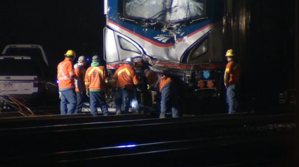 Emergency crews continue working at night after locomotive on an Amtrak train derailed, killing two people and injuring about 35.(photo grabbed from Reuters video) 