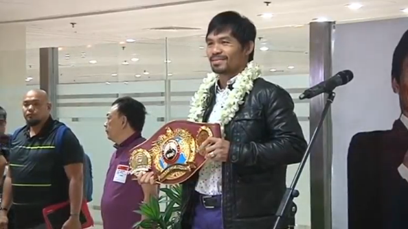 Filipino boxing icon Manny Pacquiao returns to the Philippines after his victory against Timothy Bradley and talks about his retirement and possible plans to join the Olympics.(photo grabbed from Reuters video) 