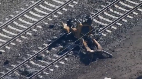 A locomotive on an Amtrak train carrying about 330 passengers derails when it hit a backhoe south of Philadelphia, killing two people and injuring about 35 in what passengers described as a jolt followed by a fireball.(photo grabbed from Reuters video) 