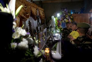 President Benigno S. Aquino III personally extends his condolences to the family of slain CPL Rodelio Bangcarin during the wake at the Bangcarin Residence, Barangay Ayala Zamboanga City on Wednesday (April 13). Also in photo is Nerissa Bangcarin, wife of the slain victim. (Photo by Rey Baniquet / Malacañang Photo Bureau)