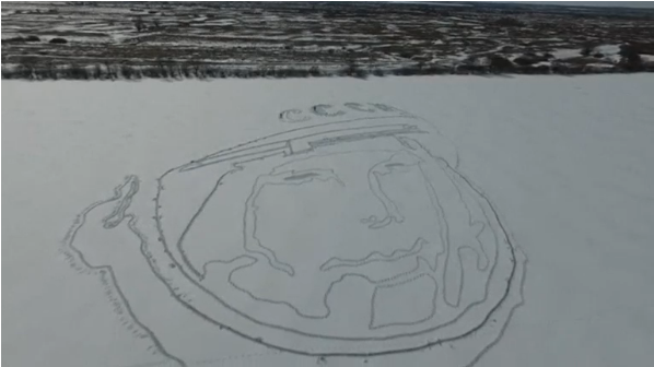 Russian enthusiasts make a giant portrait of the Soviet cosmonaut and first man in space, Yuri Gagarin, on snow in Ryazan region.(photo grabbed from Reuters video) 
