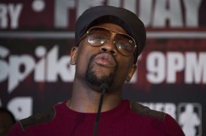(File photo) Promoter and former champion boxer Floyd Mayweather (C) speaks during a press conference announcing WBA super lightweight champion Adrien Broner's fight against Ashley Theophane, in Washington, DC, February 29, 2016. / AFP PHOTO / JIM WATSON