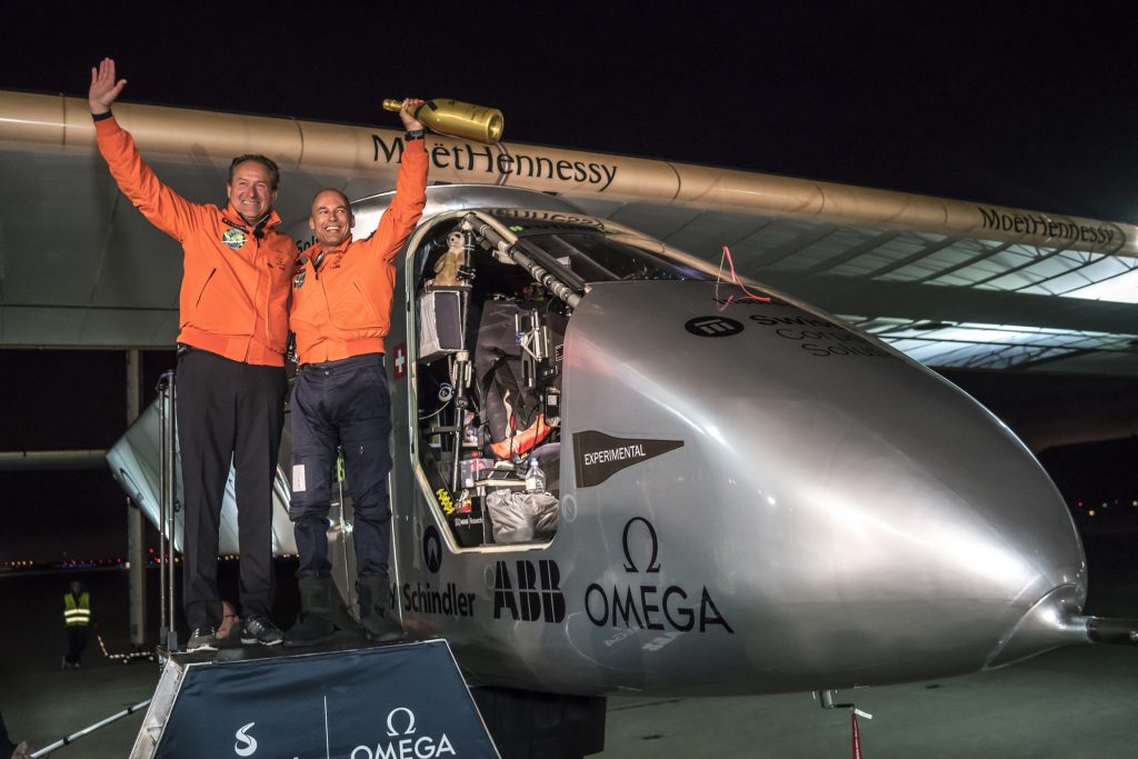 This handout photo taken late on April 23, 2016 and released by Solar Impulse 2 shows Swiss pilot Bertrand Piccard (R) reacting together with alternate pilot Andre Borschberg after landing "Solar Impulse 2", a solar powered plane on Moffett Airfield in Mountain View, California after a flight from Hawaii. Solar Impulse 2, an experimental plane flying around the world without consuming a drop of fuel, landed in California, one leg closer to completing its trailblazing trip.  / AFP PHOTO / Solar Impulse 2 / Jean Revillard / -----EDITORS NOTE --- RESTRICTED TO EDITORIAL USE - MANDATORY CREDIT "AFP PHOTO / Jean Revillard / Solar Impulse 2 / Global Newsroom" - NO MARKETING - NO ADVERTISING CAMPAIGNS - DISTRIBUTED AS A SERVICE TO CLIENTS - NO ARCHIVES