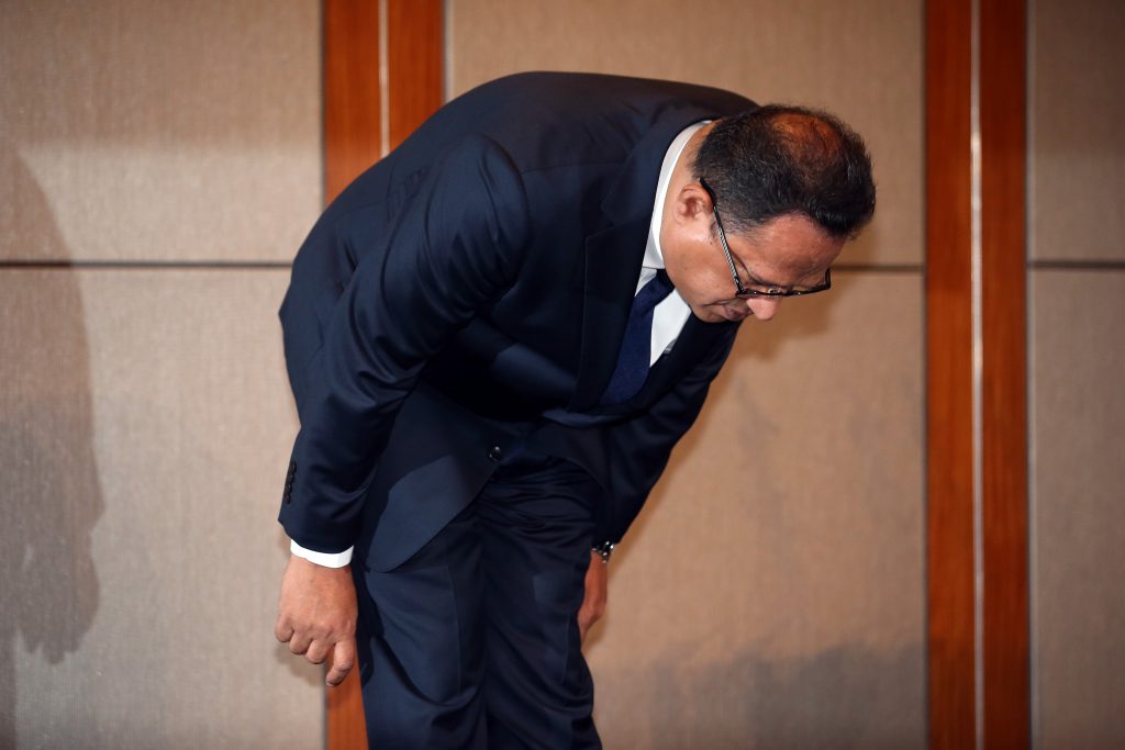 Atar Safdar, the head of Oxy Reckitt Benckiser Korea, bows during a press conference at a hotel in Seoul on May 2, 2016. The head of the Korean subsidiary of a British consumer goods company was slapped and shouted down Monday as he apologised for his firm's role in selling a humidifier disinfectant blamed for more than 100 deaths in South Korea. Shouting "too late" and "cannot forgive" in English, a handful of victims' relatives rushed the podium where Atar Safdar, the head of Oxy Reckitt Benckiser Korea, was speaking at a hotel in Seoul. / AFP PHOTO / YONHAP / Yonhap / REPUBLIC OF KOREA OUT NO ARCHIVES RESTRICTED TO SUBSCRIPTION USE