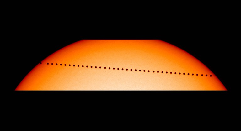 (FILES) This file NASA handout picture taken on May 08, 2003 shows  a composite image from the Solar and Heliospheric Observatory (SOHO) showing the planet Mercury in transit.   On May 9, 2016, the smallest plantet in the solar system, Mercury will delight astronomers across the world, and some robotic observatories in space, with its several hour dash across the disk of the sun.  / AFP PHOTO / NASA / NASA