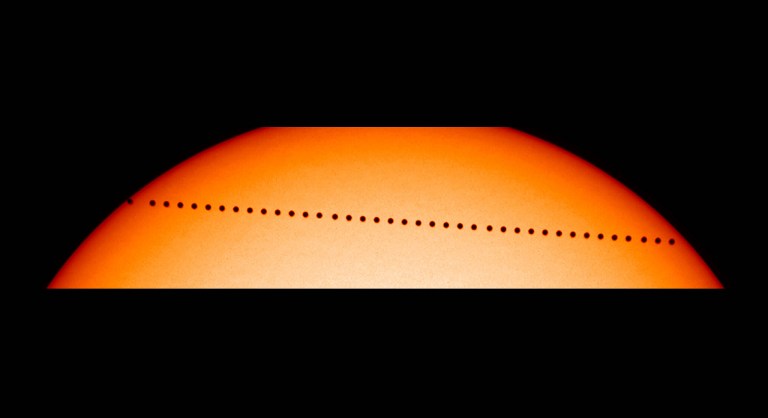(FILES) This file NASA handout picture taken on May 08, 2003 shows a composite image from the Solar and Heliospheric Observatory (SOHO) showing the planet Mercury in transit. On May 9, 2016, the smallest plantet in the solar system, Mercury will delight astronomers across the world, and some robotic observatories in space, with its several hour dash across the disk of the sun. / AFP PHOTO / NASA / NASA