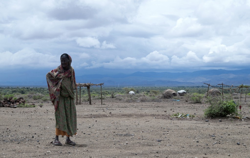 TO GO WITH AFP STORY BY KARIM LEBHOUR (FILES) This file photo taken on April 16, 2016 shows an elderly herder woman walking in Sitti Zone, in the Somali Region of Ethiopia. Stuck on a track in eastern Ethiopia, trucks carrying food for the starving are forced to turn back. After one of the worst droughts for decades, the rains have finally arrived, but now only add to the complication of the delivery of food aid. / AFP PHOTO / VINCENT DEFAIT