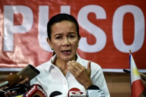 Philippine presidential candidate Senator Grace Poe speaks at a press conference after she conceded as the ongoing tally placed her third with 21,87 percent, in Manila on May 9, 2016. Anti-establishment firebrand Rodrigo Duterte was set to secure a huge win in the May 9 Philippine presidential elections, according to a poll monitor, after an incendiary campaign dominated by his profanity-laced vows to kill criminals.  / AFP PHOTO / MOHD RASFAN