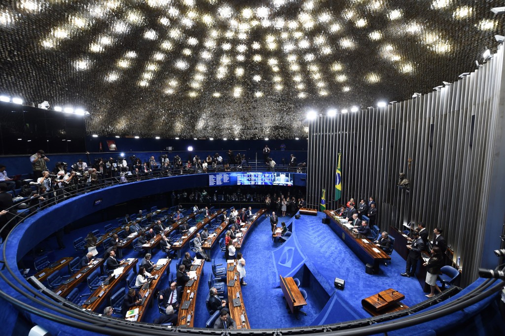 Overview of the Senate session during a debate of a vote on suspending President Dilma Rousseff and launching an impeachment trial, in Brasilia on May 11, 2016. Brazil's Senate opened debate Wednesday ahead of a vote on suspending President Dilma Rousseff and launching an impeachment trial that could bring down the curtain on 13 years of leftist rule in Latin America's biggest country. Even allies of Rousseff, 68, said she had no chance of surviving the vote. / AFP PHOTO / EVARISTO SA