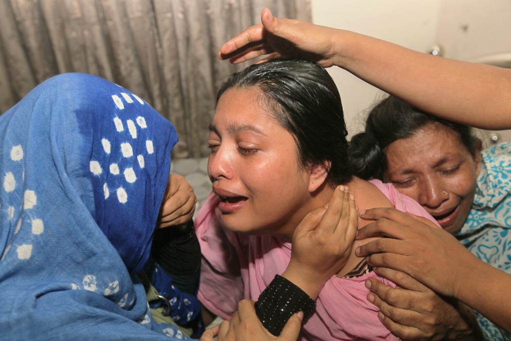 Bangladeshi relatives of teenage cricketer Babul Shikdar, 16, who died after allegedly being beaten by a batsman during a friendly cricket match, react at their home in Dhaka on May 11, 2016.  A teenage cricketer in Bangladesh was allegedly killed by a stump-wielding batsman after he taunted the umpire over a no-ball delivery, police said May 12. Sixteen-year-old Babul Shikdar was wicketkeeping during a neighbourhood match with friends in the capital Dhaka on Wednesday when the batsman was given out, local police chief Bhuiyan Mahboob Hasan said.  / AFP PHOTO / STR