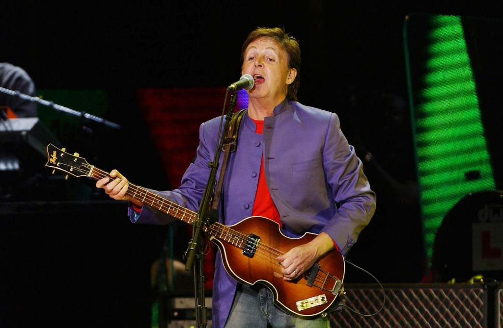 Former Beatles, Sir Paul Mc Cartney performs during a concert in front of Rome's Ancient Coliseum, late 11 May 2003. Around half million people from across Italy attended his free concert. AFP PHOTO STRINGER / AFP PHOTO / STR