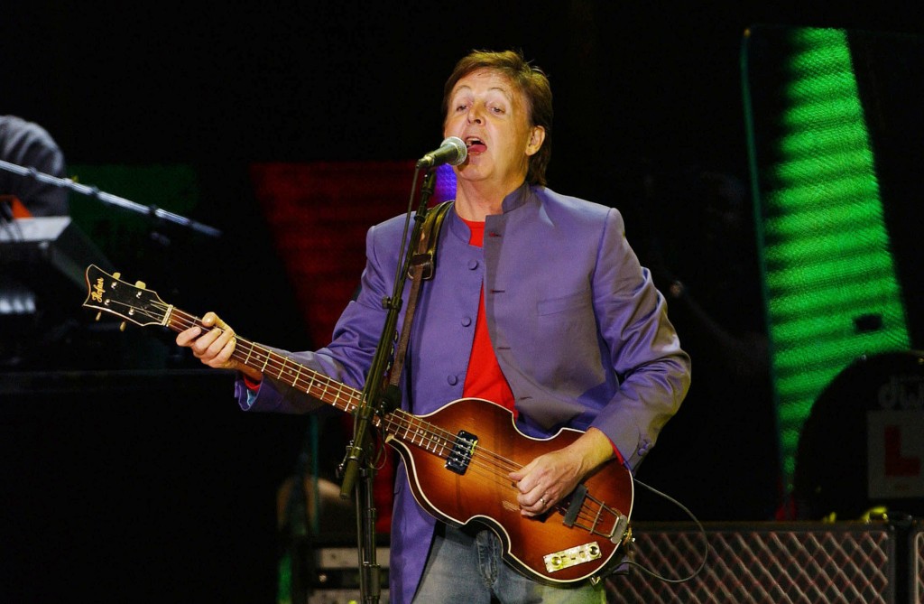Former Beatles, Sir Paul Mc Cartney performs during a concert in front of Rome's Ancient Coliseum, late 11 May 2003. Around half million people from across Italy attended his free concert.                  AFP PHOTO STRINGER / AFP PHOTO / STR