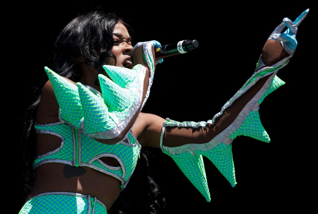 American rapper Azealia Banks performs on the Pyramid Stage on the forth day of the Glastonbury Festival of Contemporary Performing Arts near Glastonbury, southwest England on June 29, 2013. The sun was out for Britain's world-renowned Glastonbury festival, drying the mud underfoot as tens of thousands waited for the first ever performance here by the Rolling Stones. AFP PHOTO/ANDREW COWIE / AFP PHOTO / ANDREW COWIE