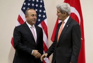 Turkish Foreign Minister Mevlut Cavusoglu (L) speaks with US Secretary of State John Kerry during a meeting of the North Atlantic Council at NATO headquarters in Brussels on May 20, 2016. NATO's chief says the alliance has reached a broad agreement to seek another meeting with Russia before NATO heads of state and government meet in Warsaw this July. / AFP PHOTO / POOL / Virginia Mayo