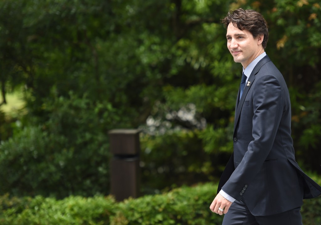 Canadian Prime Minister Justin Trudeau arrives at Ise-Jingu Shrine in the city of Ise in Mie prefecture, on May 26, 2016, on the first day of the G7 leaders summit. World leaders kicked off two days of G7 talks in Japan on May 26 with the creaky global economy, terrorism, refugees, China's controversial maritime claims, and a possible Brexit headlining their packed agenda. / AFP PHOTO / STEPHANE DE SAKUTIN