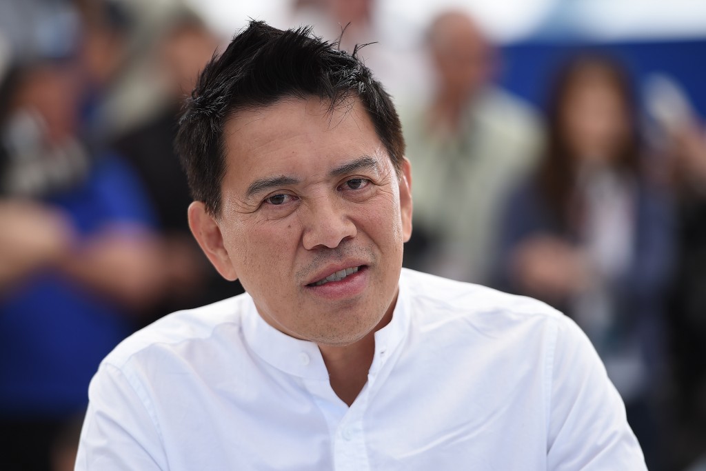 Filipino director Brillante Mendoza poses during a photocall for the film "Taklub" at the 68th Cannes Film Festival in Cannes, southeastern France, on May 20, 2015. AFP PHOTO / ANNE-CHRISTINE POUJOULAT / AFP PHOTO / ANNE-CHRISTINE POUJOULAT
