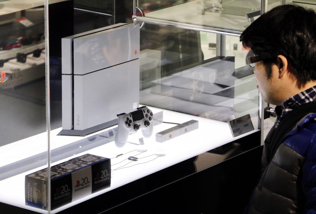 Sony Computer Entertainment's PlayStation 4 20th anniversary edition video game console is displayed at Sony's showroom in Tokyo on December 4, 2014. The PS4 special edition model will be limited to 12,300 units worldwide with a price of 499 USD. PlayStation was the first video game console to ship over 100 million units. AFP PHOTO / Yoshikazu TSUNO / AFP PHOTO / YOSHIKAZU TSUNO