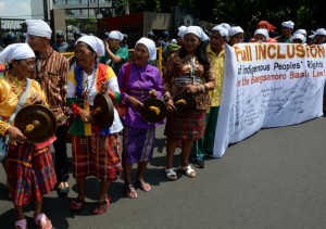 (File photo) Indigenous minorities hit gongs as they call on legislators to include their sector in the Bangsamoro Basic Law (BBL) in Manila on May 11, 2015. AFP PHOTO / TED ALJIBE
