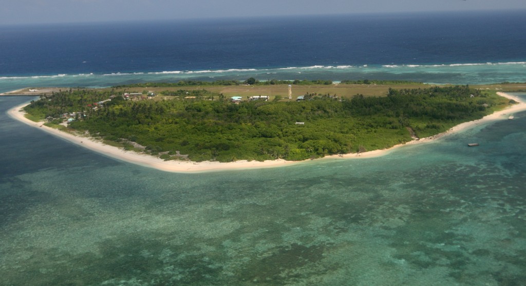 An aerial photo shows Thitu Island, part of the disputed Spratly group of islands, in the South China Sea located off the coast of western Philippines on July 20, 2011. Philippine lawmakers flew to an island in the disputed Spratly chain, despite warnings from China that the trip would destabilise the region and damage ties. AFP PHOTO / POOL / AFP PHOTO / POOL / ROLEX DELA PENA