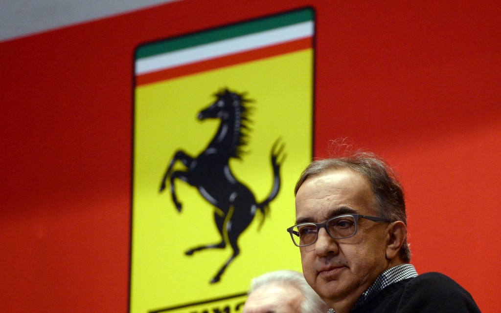 Chief Executive Officer of Fiat Chrysler Automobiles Group Sergio Marchionne waits to ring the opening bell at the New York Stock Exchange (NYSE) as Ferrari starts trading for the first day in New York on October 21, 2015. The Dow clung to a modest gain, but the Nasdaq fell early Wednesday as traders weighed big technology deals, mixed earnings and Ferrari's roaring debut on Wall Street. AFP PHOTO/JEWEL SAMAD / AFP PHOTO / JEWEL SAMAD