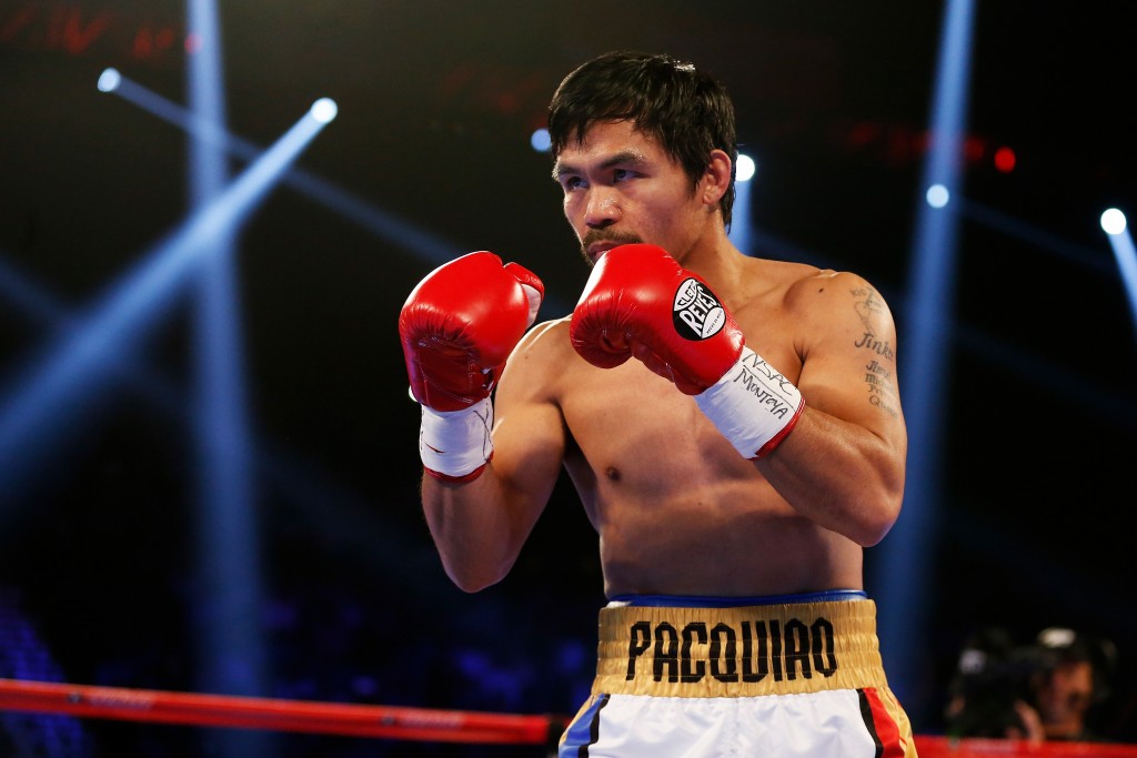 LAS VEGAS, NEVADA - APRIL 09: Manny Pacquiao looks to strike Timothy Bradley Jr. during their welterweight championship fight on April 9, 2016 at MGM Grand Garden Arena in Las Vegas, Nevada. Christian Petersen/Getty Images/AFP