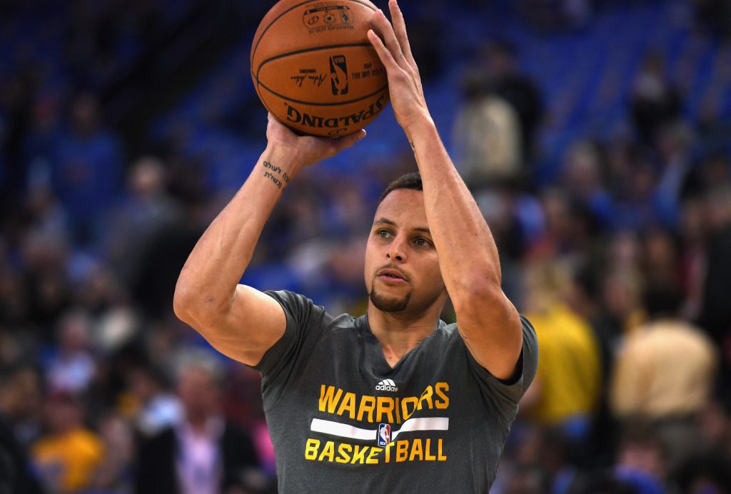OAKLAND, CA - APRIL 13: Stephen Curry #30 of the Golden State Warriors warms up prior to the game against the Memphis Grizzlies at ORACLE Arena on April 13, 2016 in Oakland, California. Thearon W. Henderson/Getty Images/AFP