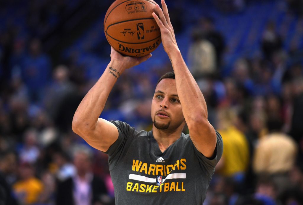 OAKLAND, CA - APRIL 13: Stephen Curry #30 of the Golden State Warriors warms up prior to the game against the Memphis Grizzlies at ORACLE Arena on April 13, 2016 in Oakland, California.   Thearon W. Henderson/Getty Images/AFP