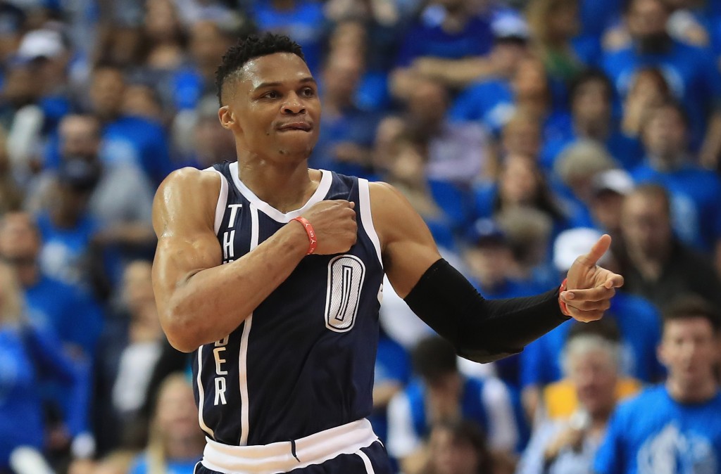 DALLAS, TX - APRIL 21: Russell Westbrook #0 of the Oklahoma City Thunder reacts after making a three-point shot against the Dallas Mavericks during game three of the Western Conference Quarterfinals of the 2016 NBA Playoffs at American Airlines Center on April 21, 2016 in Dallas, Texas. NOTE TO USER: User expressly acknowledges and agrees that, by downloading and or using this photograph, User is consenting to the terms and conditions of the Getty Images License Agreement.   Ronald Martinez/Getty Images/AFP