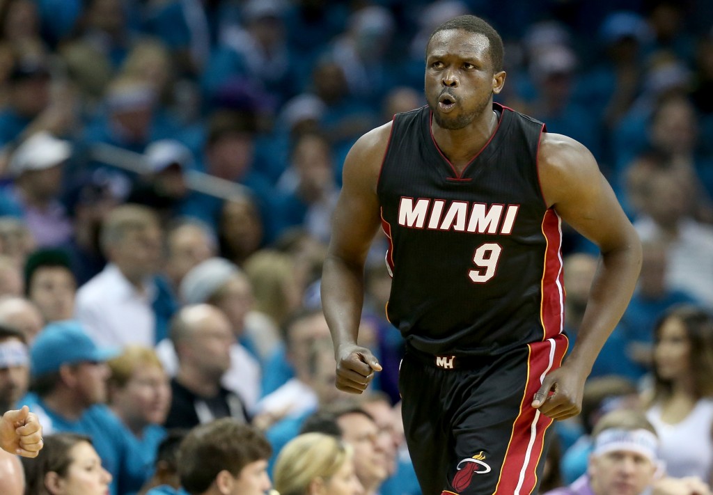 CHARLOTTE, NC - APRIL 29: Luol Deng #9 of the Miami Heat reacts after a basket against the Charlotte Hornets during game six of the Eastern Conference Quarterfinals of the 2016 NBA Playoffs at Time Warner Cable Arena on April 29, 2016 in Charlotte, North Carolina. NOTE TO USER: User expressly acknowledges and agrees that, by downloading and or using this photograph, User is consenting to the terms and conditions of the Getty Images License Agreement.   Streeter Lecka/Getty Images/AFP