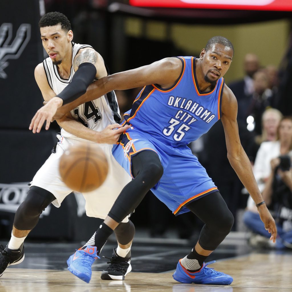 SAN ANTONIO,TX - MAY 2: Danny Green #14 of the San Antonio Spurs tries to steal the ball from Kevin Durant #35 of the Oklahoma City Thunder during game Two of the Western Conference Semifinals for the 2016 NBA Playoffs at AT&T Center on May 2, 2016 in San Antonio, Texas. NOTE TO USER: User expressly acknowledges and agrees that , by downloading and or using this photograph, User is consenting to the terms and conditions of the Getty Images License Agreement.   Ronald Cortes/Getty Images/AFP